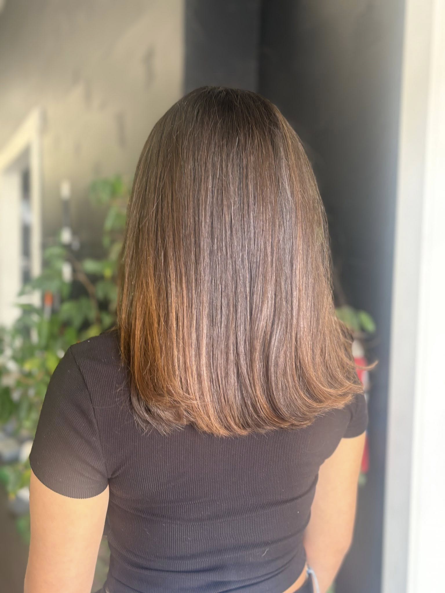 Glossy brunette lob with a soft bend